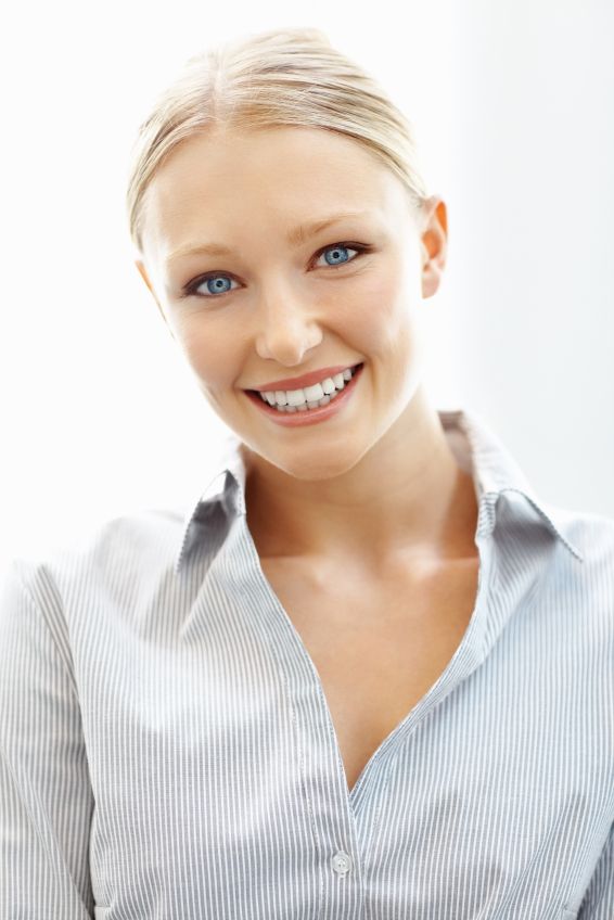 A young woman smiling with composite dental fillings in Billings.