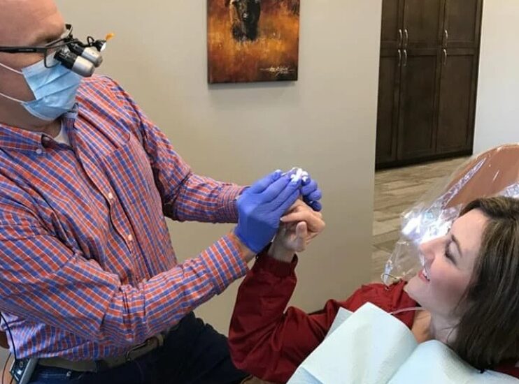 Dr. Johnson with a patient in an exam room.