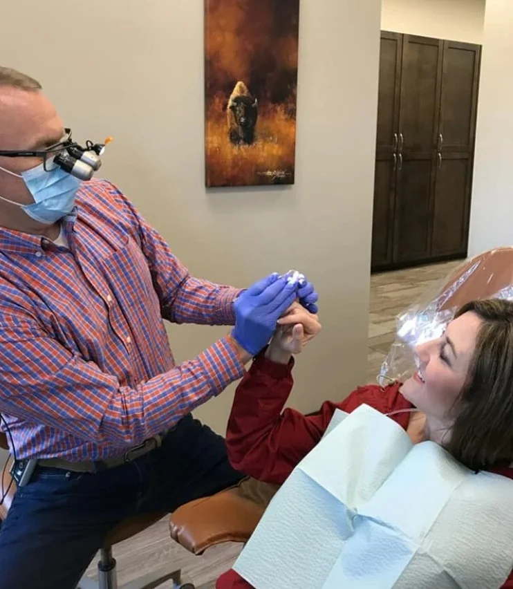 Dr. Johnson with a patient in an exam room.